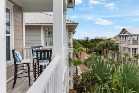 a view of a balcony with chairs
