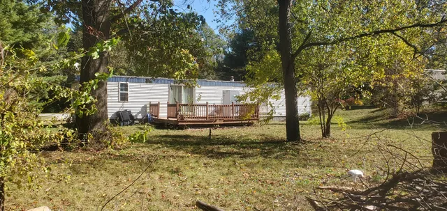a house view with a backyard space