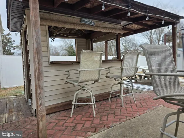 a patio with table and chairs