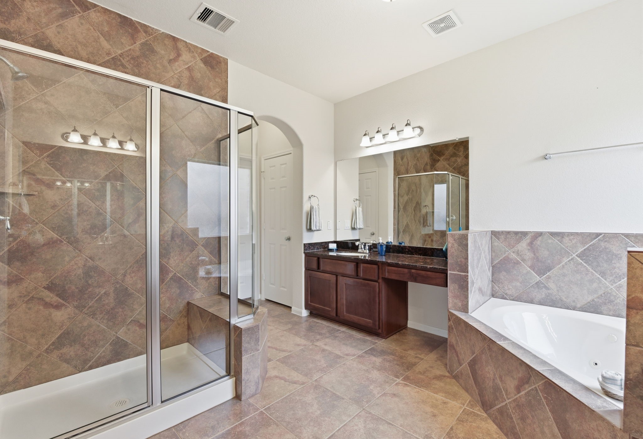 3301 Remington Rise Lane Katy, TX 77494 - Photo 23 of 50 a large bathroom with a tub shower and sink