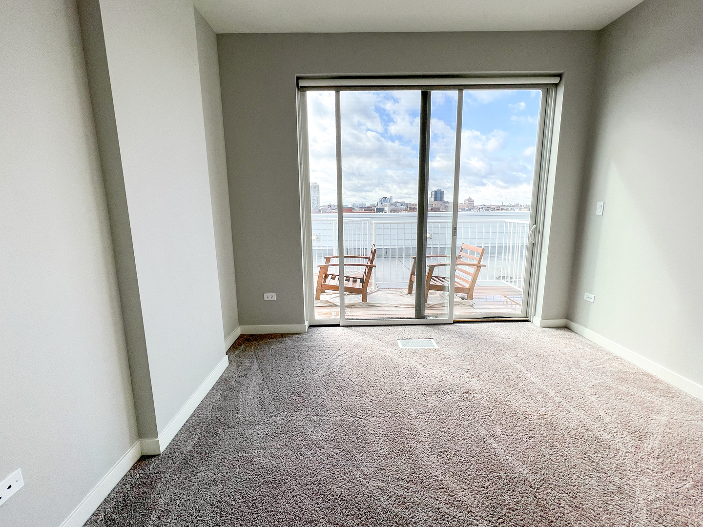 Undisclosed Address Chicago, IL 60642 - Photo 11 of 13 an empty room with windows and city view