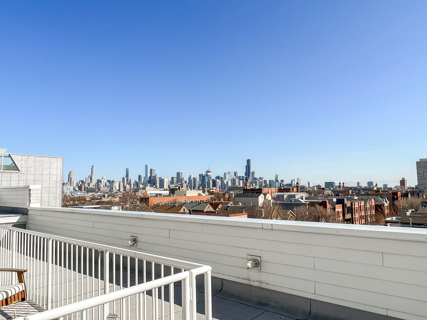 Undisclosed Address Chicago, IL 60642 - Photo 3 of 13 a view of a city from a balcony