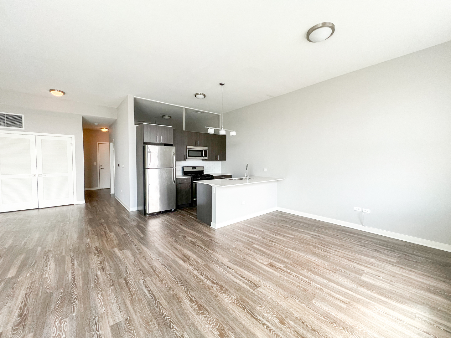 Undisclosed Address Chicago, IL 60642 - Photo 4 of 13 a view of kitchen with wooden floor