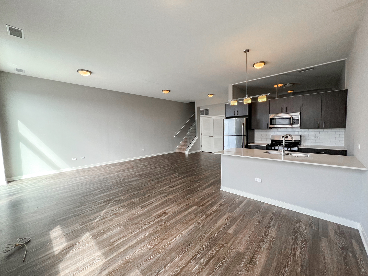 Undisclosed Address Chicago, IL 60642 - Photo 6 of 13 a view of kitchen with cabinets stainless steel appliances and wooden floor