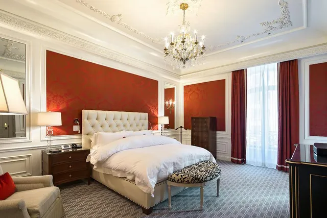 a room with furniture and painting on the wall