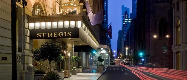 a front view of a house with parking space