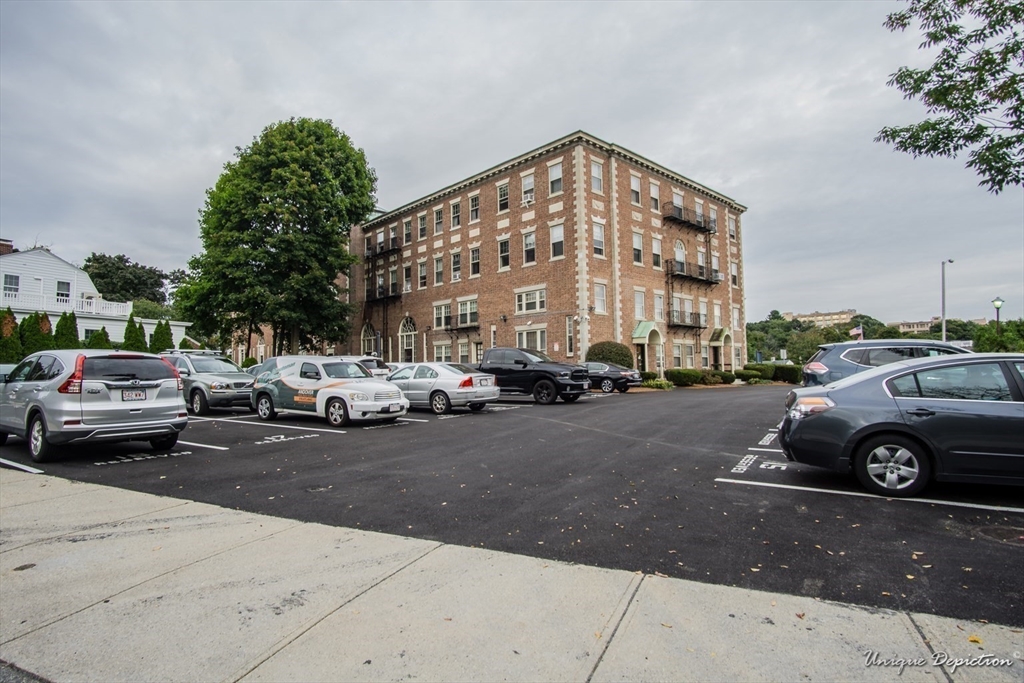 354 North Main Street, Unit 303 Andover, MA 01810 - Photo 16 of 16 a car parked in front of a building