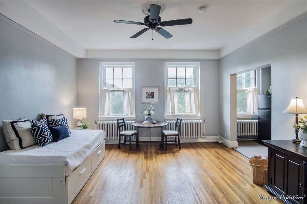 354 North Main Street, Unit 303 Andover, MA 01810 - Photo 5 of 16 a living room with furniture and a wooden floor