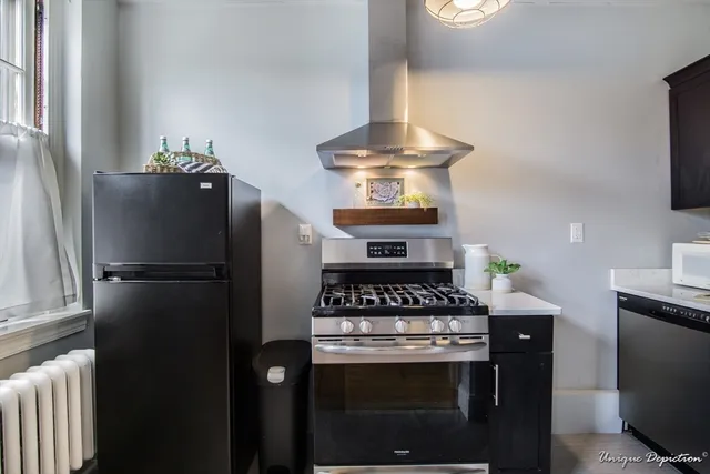 a kitchen with a stove and a refrigerator