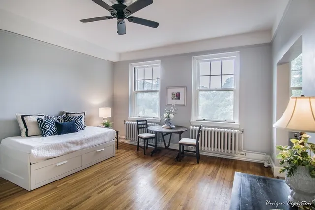 a bedroom with furniture and a window
