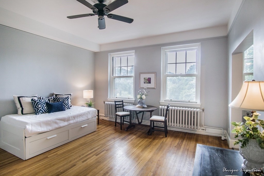 354 North Main Street, Unit 303 Andover, MA 01810 - Photo 8 of 16 a bedroom with furniture and a window
