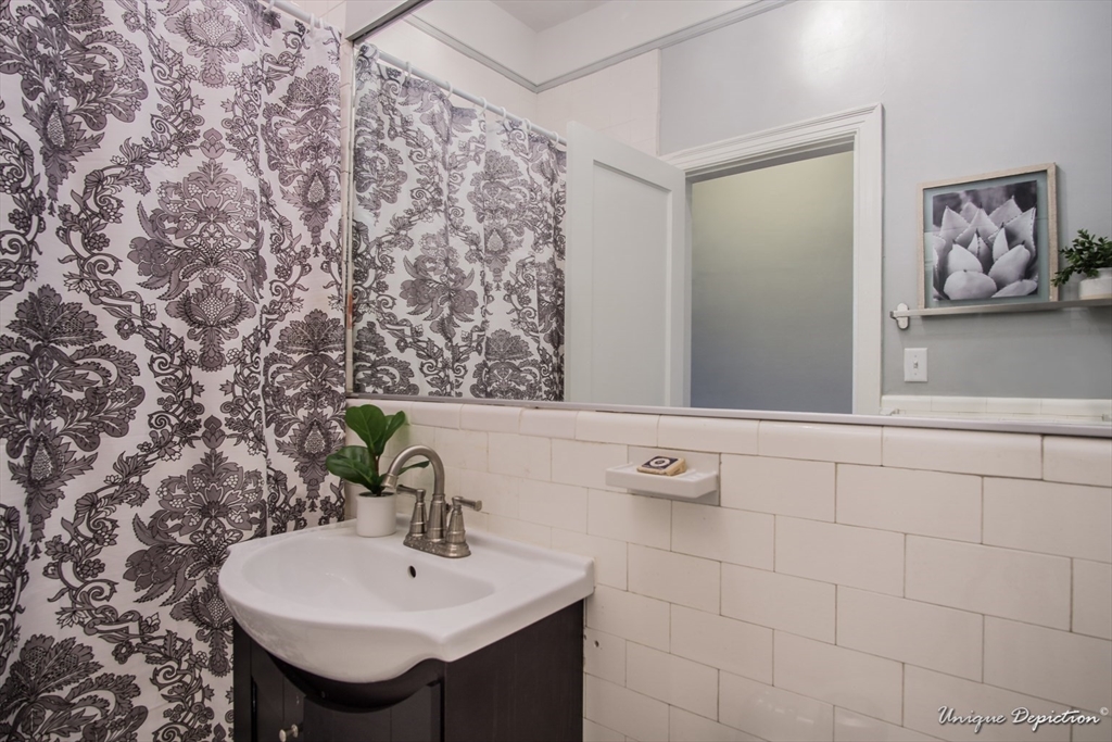 354 North Main Street, Unit 303 Andover, MA 01810 - Photo 10 of 16 a bathroom with a sink and a mirror