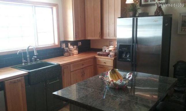 2160 West Storm Road Paulden, AZ 86334 - Photo 11 of 18 a kitchen with a sink refrigerator and window