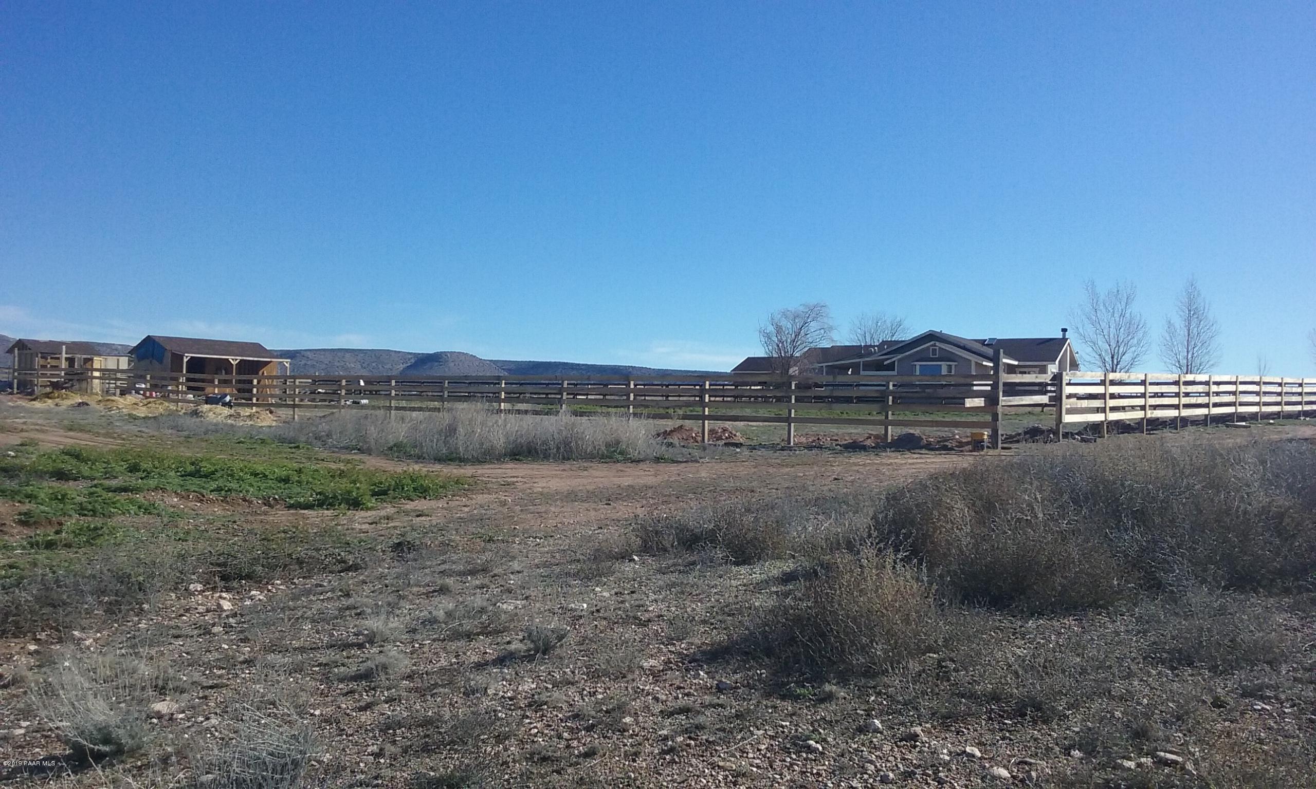 2160 West Storm Road Paulden, AZ 86334 - Photo 15 of 18 a view of a dry yard with wooden fence