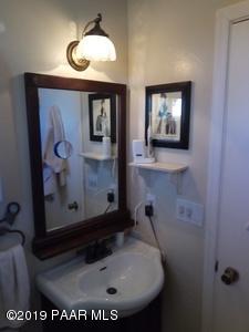 2160 West Storm Road Paulden, AZ 86334 - Photo 8 of 18 a bathroom with a sink and a mirror