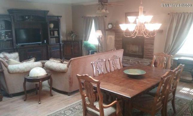 2160 West Storm Road Paulden, AZ 86334 - Photo 10 of 18 a view of a dining room with furniture and wooden floor