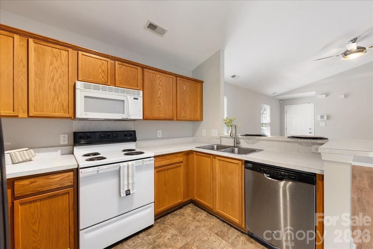 2872 Signal Court Southwest Concord, NC 28025 - Photo 17 of 43 a kitchen with a sink stove and microwave