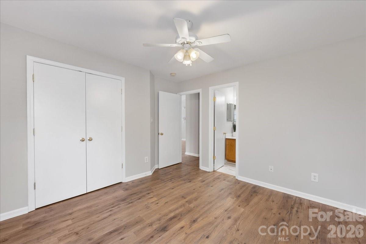 2872 Signal Court Southwest Concord, NC 28025 - Photo 22 of 43 a view of an empty room with wooden floor
