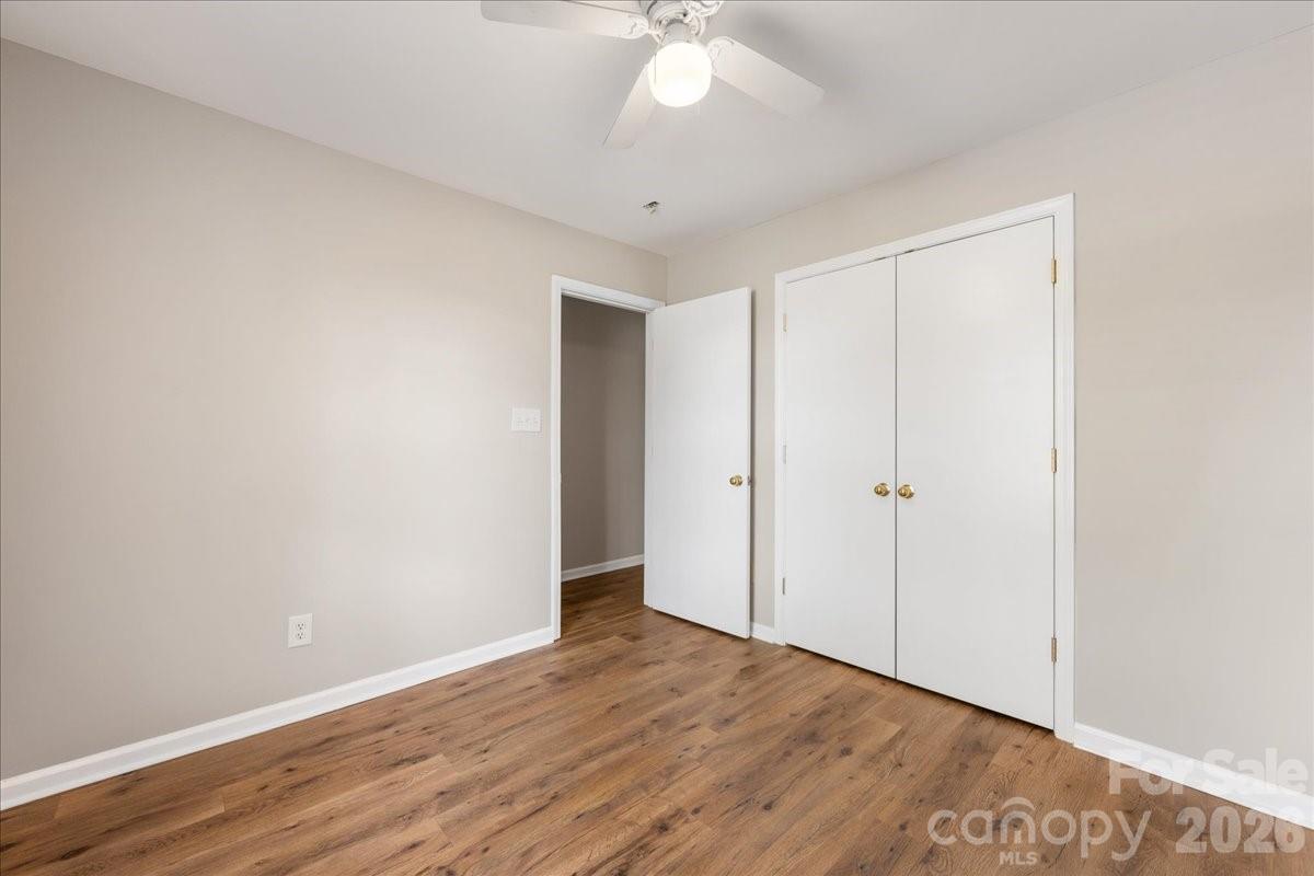 2872 Signal Court Southwest Concord, NC 28025 - Photo 30 of 43 a view of an empty room with wooden floor
