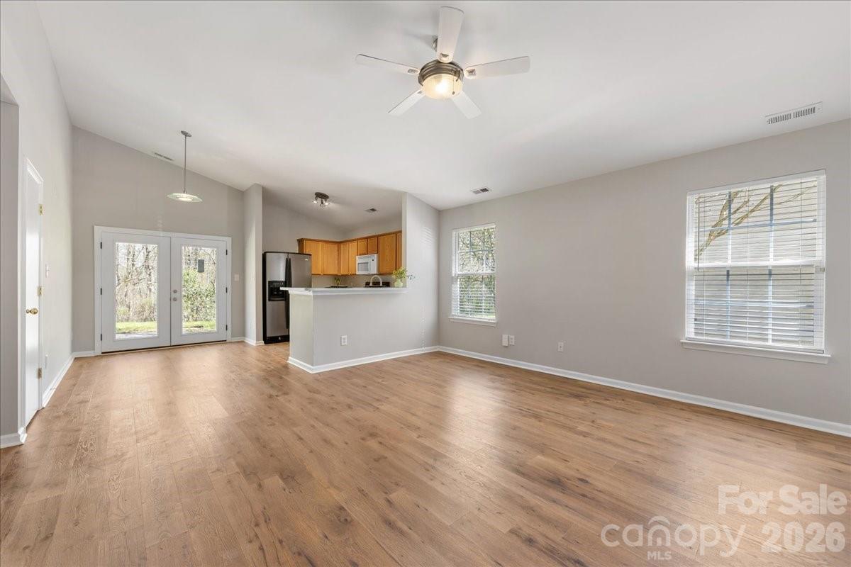 2872 Signal Court Southwest Concord, NC 28025 - Photo 3 of 43 a view of an empty room with a window and wooden floor