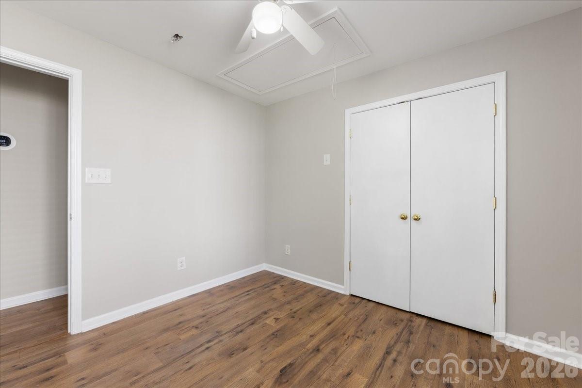 2872 Signal Court Southwest Concord, NC 28025 - Photo 37 of 43 a view of an empty room with wooden floor
