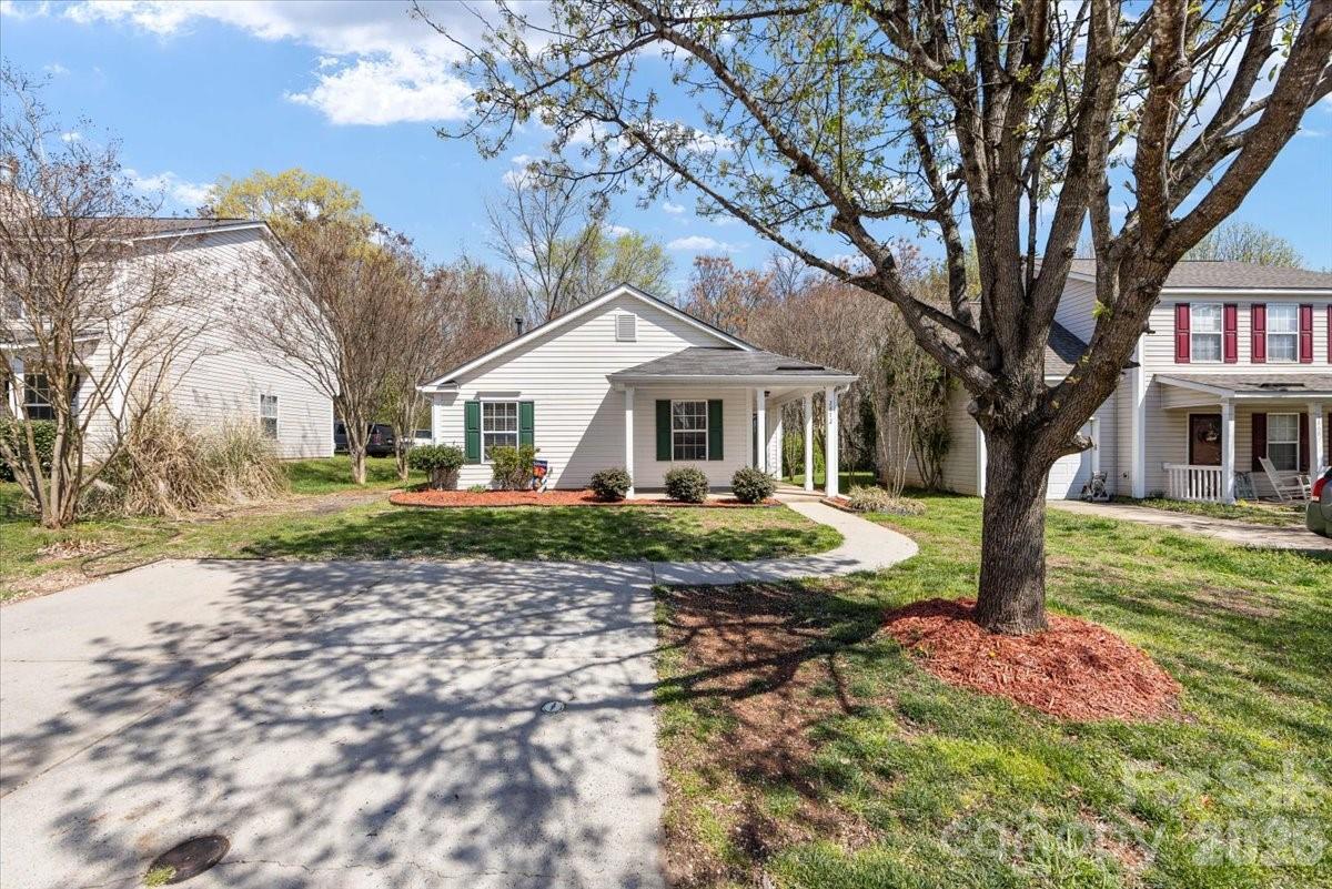 2872 Signal Court Southwest Concord, NC 28025 - Photo 5 of 43 a front view of a house with garden