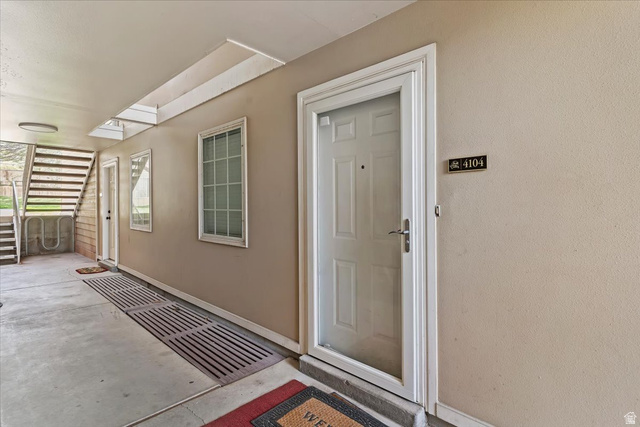 650 South Main Street, Unit 4104 Bountiful, UT 84010 - Photo 2 of 22 Doorway to property featuring stucco siding and a patio area
