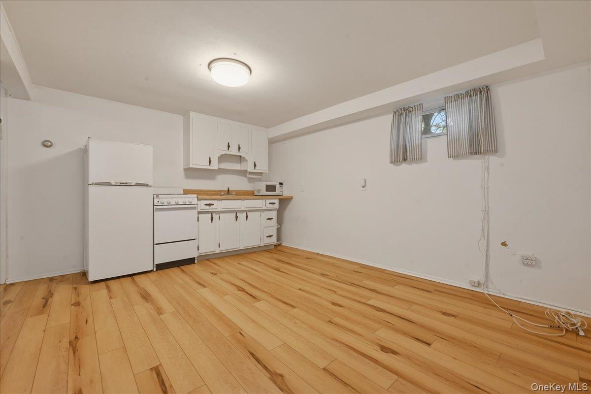 17 Avon Road Farmingdale, NY 11735 - Photo 31 of 46 a view of a kitchen with wooden floor