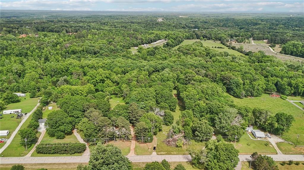 955 Highway 82 Jefferson, GA 30549 - Photo 20 of 28 an aerial view of residential houses with outdoor space and trees