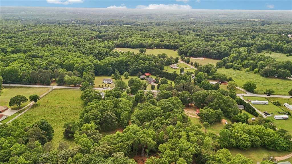 955 Highway 82 Jefferson, GA 30549 - Photo 24 of 28 an aerial view of residential houses with outdoor space and trees