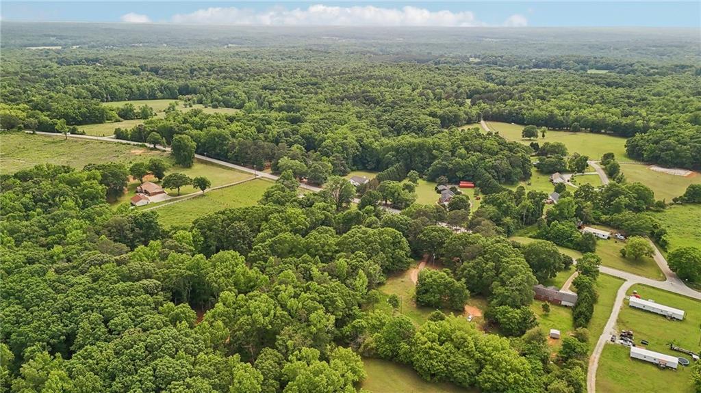 955 Highway 82 Jefferson, GA 30549 - Photo 25 of 28 an aerial view of residential houses with outdoor space and trees