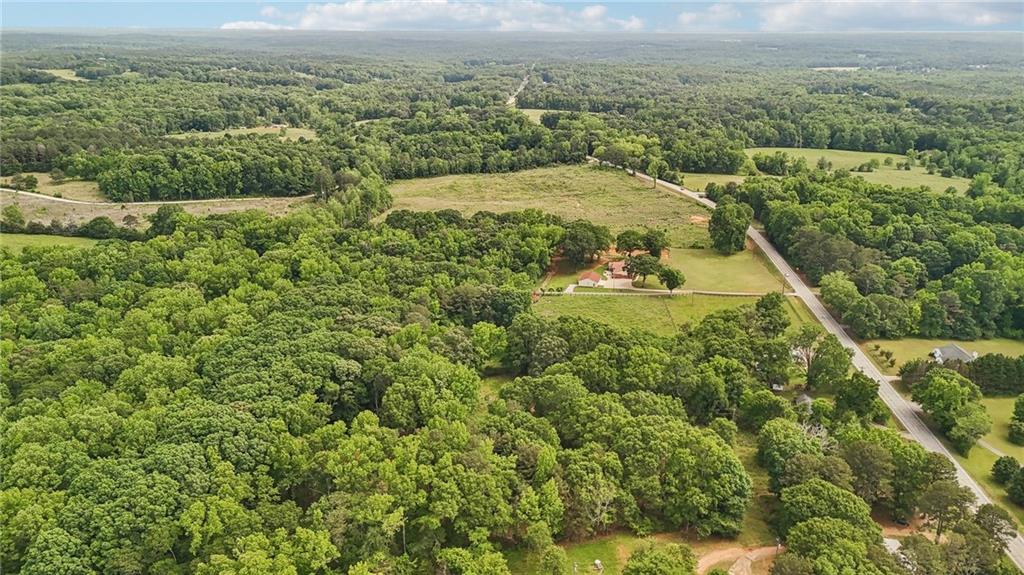 955 Highway 82 Jefferson, GA 30549 - Photo 26 of 28 an aerial view of residential houses with outdoor space and trees
