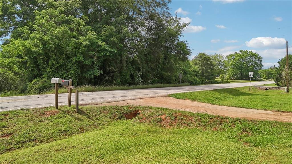 955 Highway 82 Jefferson, GA 30549 - Photo 3 of 28 a swimming pool with wooden fence