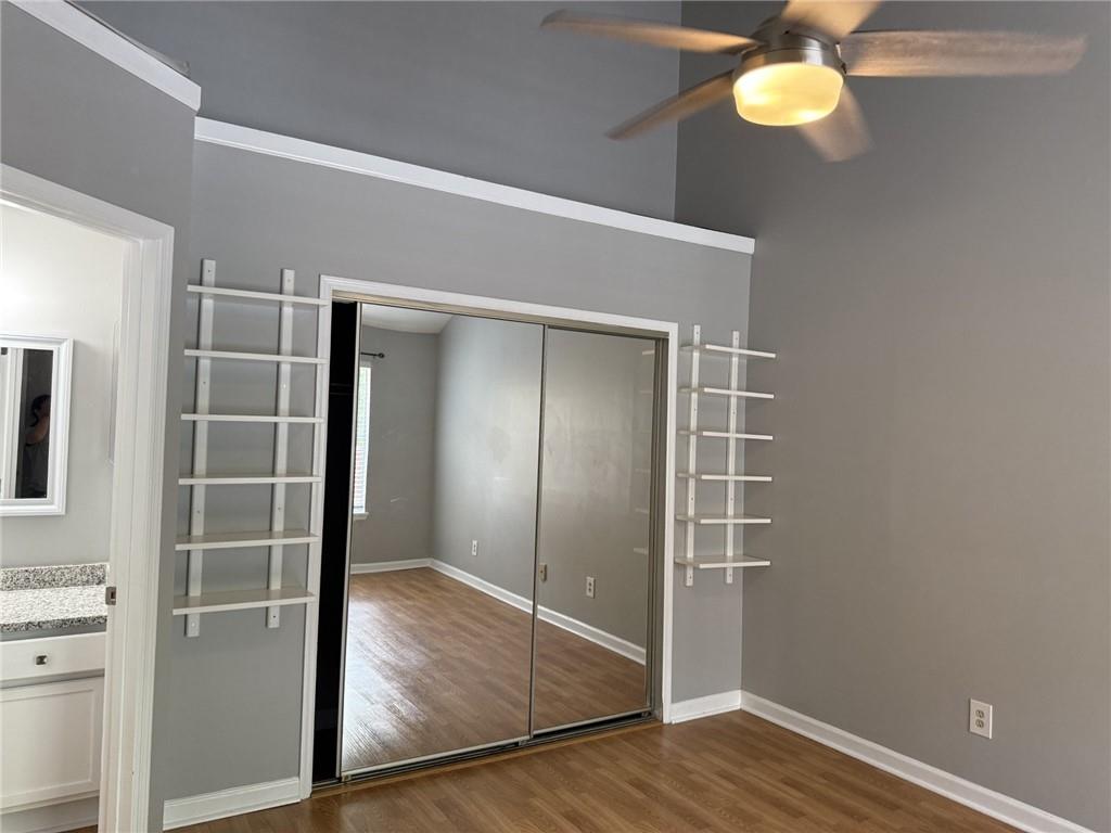 105 Hawkstone Way Alpharetta, GA 30022 - Photo 18 of 23 a view of an empty room with wooden floor and a window
