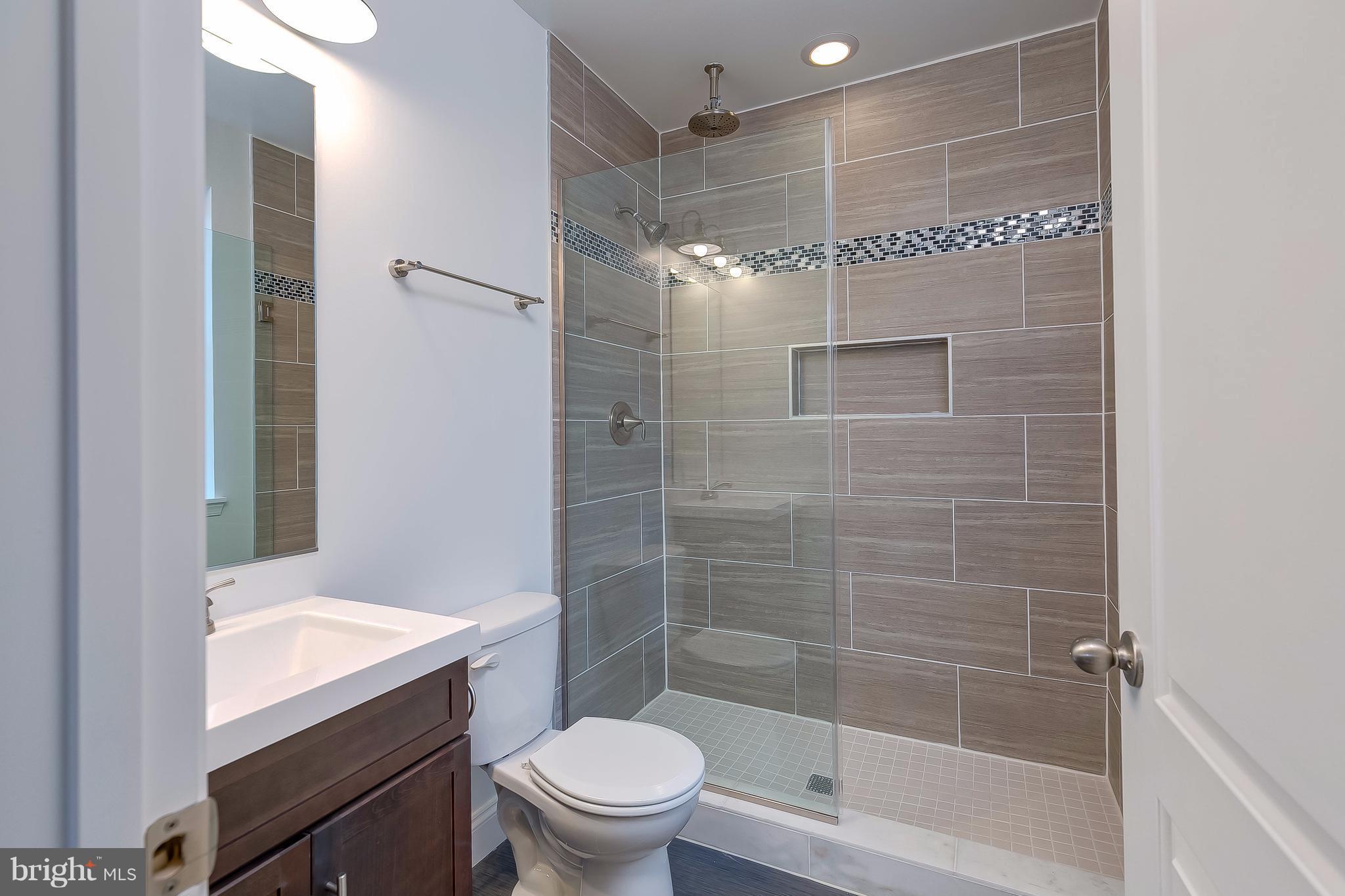 800 South Streeper Street Baltimore, MD 21224 - Photo 16 of 17 a bathroom with a shower and a toilet