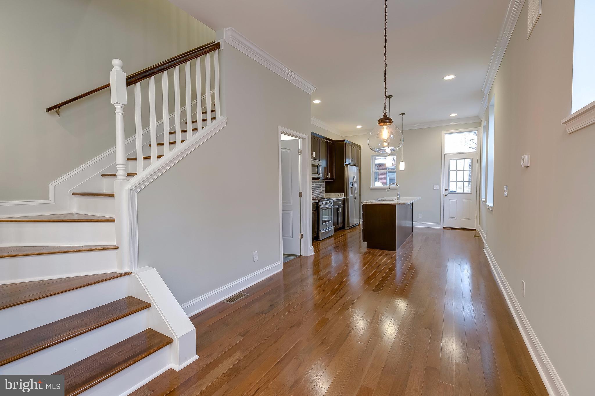 800 South Streeper Street Baltimore, MD 21224 - Photo 3 of 17 a view of a kitchen with wooden floor and a kitchen