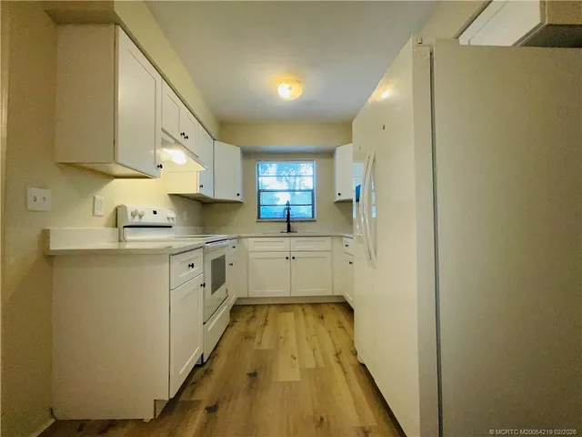 a bathroom with a sink a mirror and a bathtub