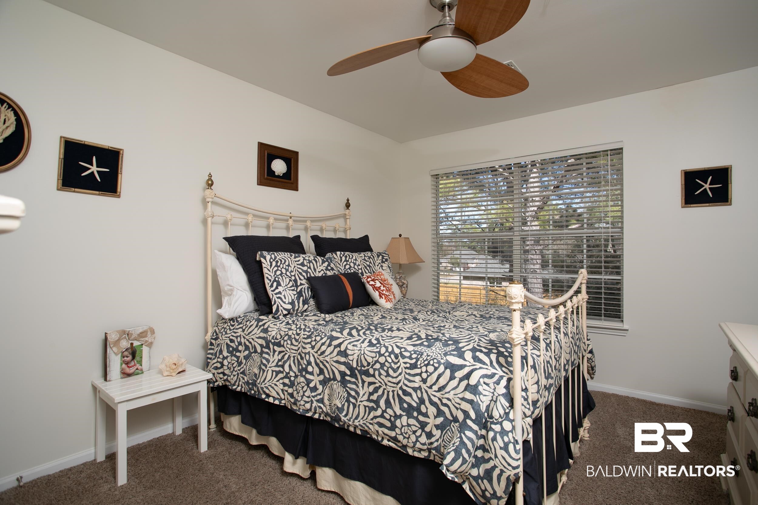1517 Regency Road, Unit 33 Gulf Shores, AL 36542 - Photo 20 of 29 Bedroom featuring carpet flooring, a ceiling fan, and baseboards