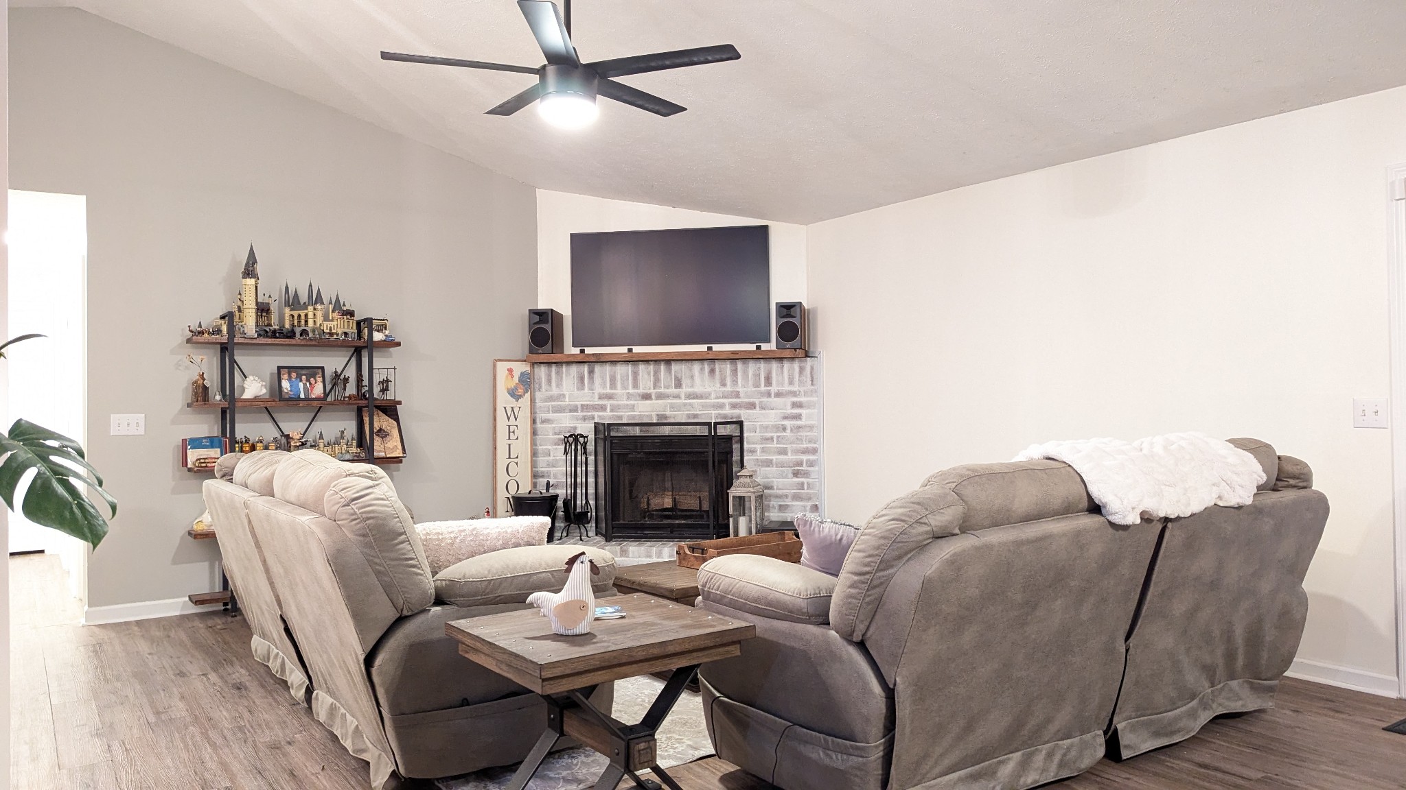 1099 North Boiling Springs Road Portland, TN 37148 - Photo 18 of 39 a living room with furniture a fireplace and a flat screen tv