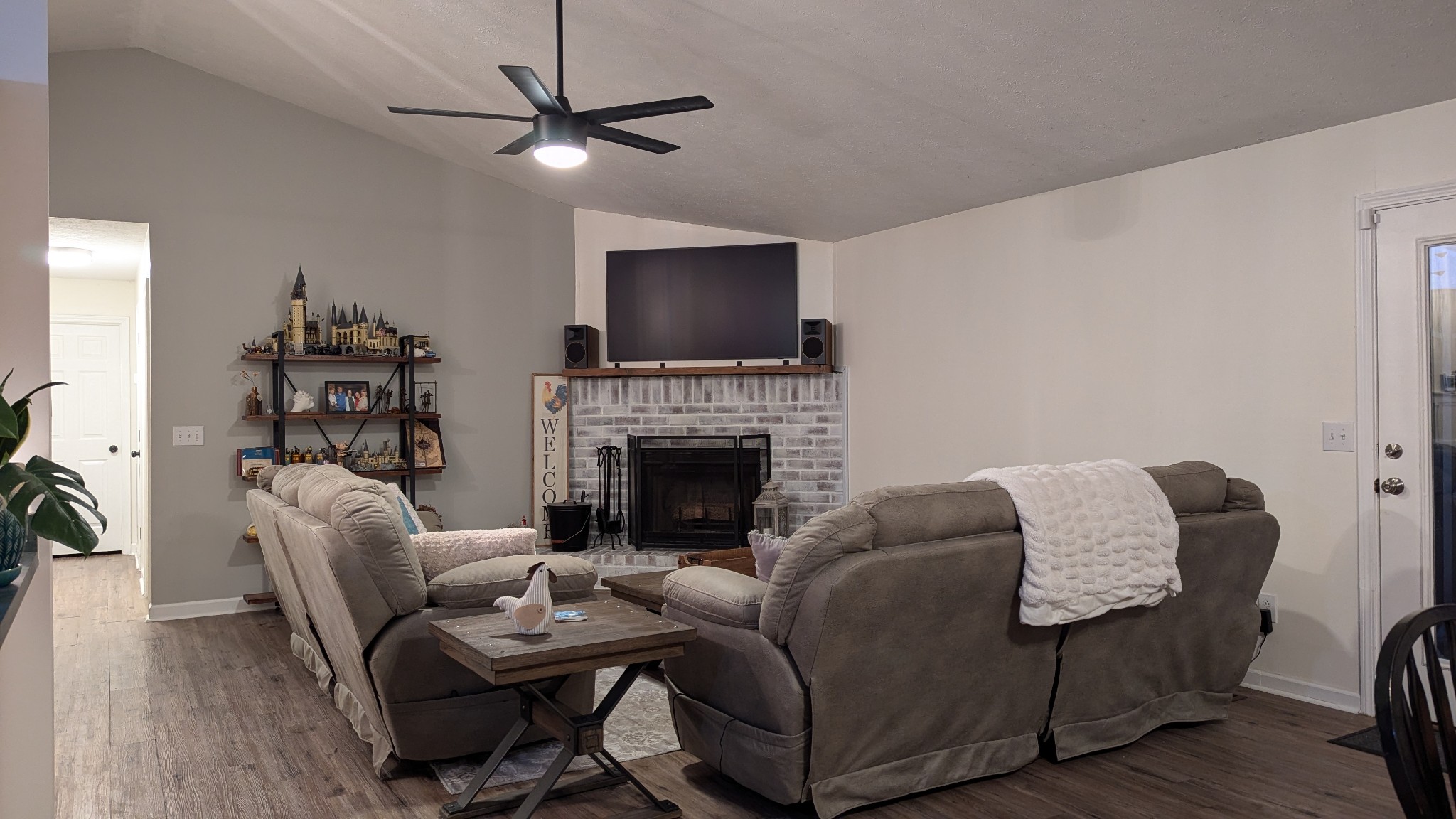 1099 North Boiling Springs Road Portland, TN 37148 - Photo 6 of 39 a living room with furniture a flat screen tv and a fireplace