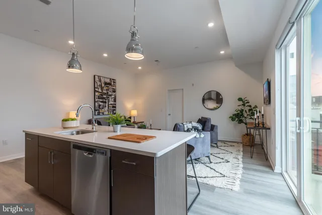 a kitchen with a table and chairs