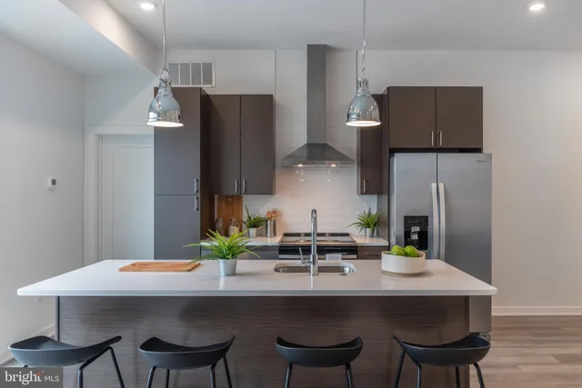 a kitchen with a table and chairs