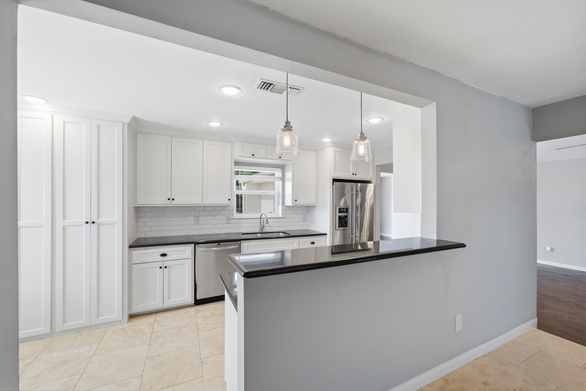 2502 Hollow Hook Road Houston, TX 77080 - Photo 12 of 35 a kitchen with stainless steel appliances granite countertop a sink and a refrigerator