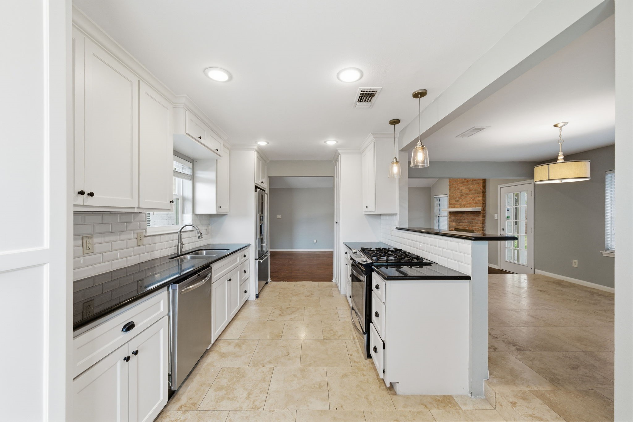 2502 Hollow Hook Road Houston, TX 77080 - Photo 14 of 35 a kitchen with granite countertop cabinets and refrigerator