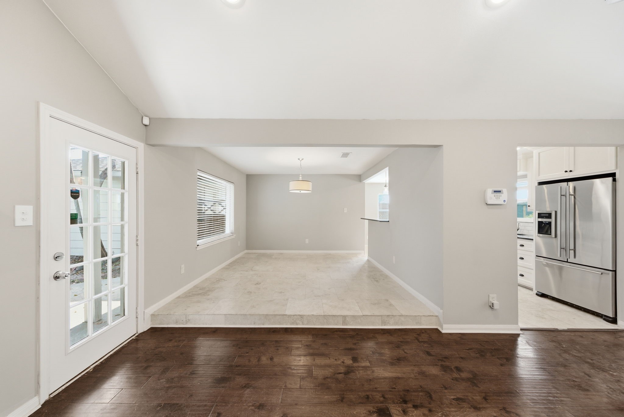 2502 Hollow Hook Road Houston, TX 77080 - Photo 16 of 35 a view of a kitchen with wooden floor and a refrigerator