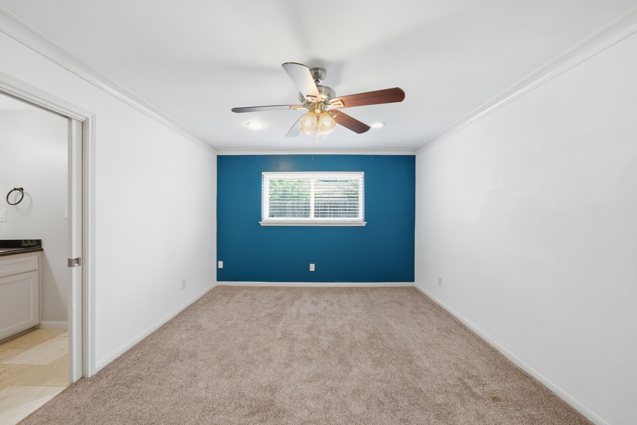2502 Hollow Hook Road Houston, TX 77080 - Photo 20 of 35 a view of a room with a ceiling fan and a window