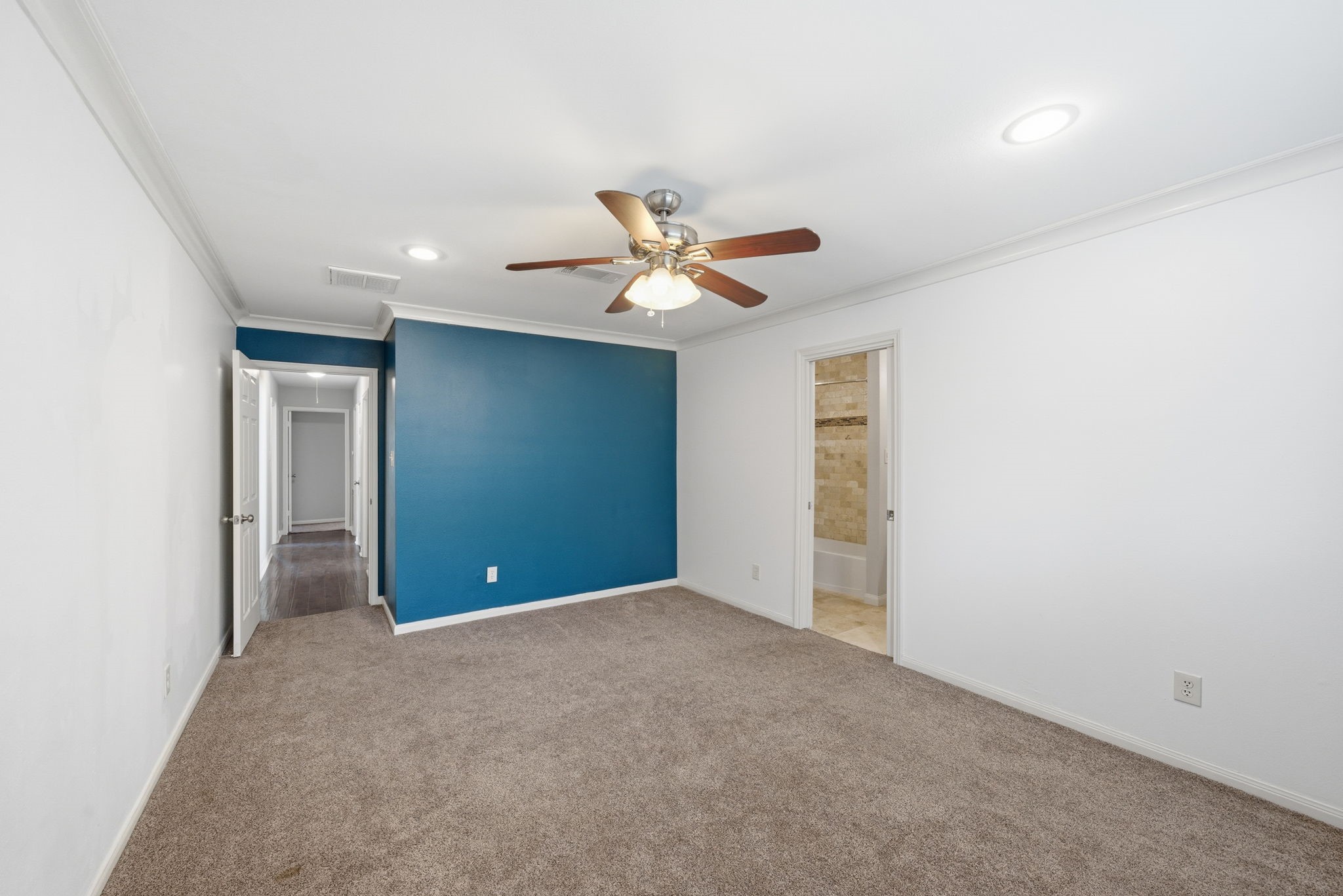 2502 Hollow Hook Road Houston, TX 77080 - Photo 21 of 35 a view of an empty room with a ceiling fan