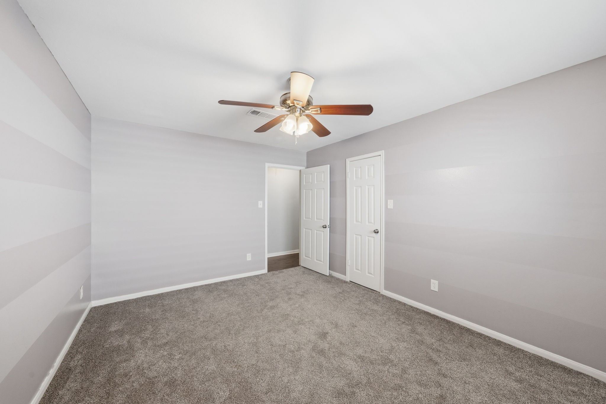 2502 Hollow Hook Road Houston, TX 77080 - Photo 23 of 35 a view of a room with a ceiling fan and a chandelier fan