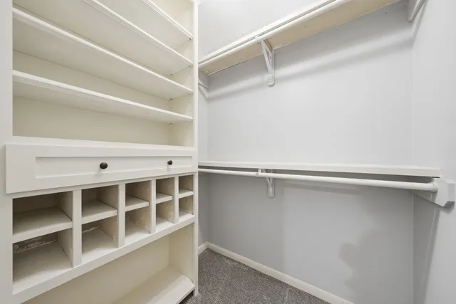 a view of an empty walk in closet