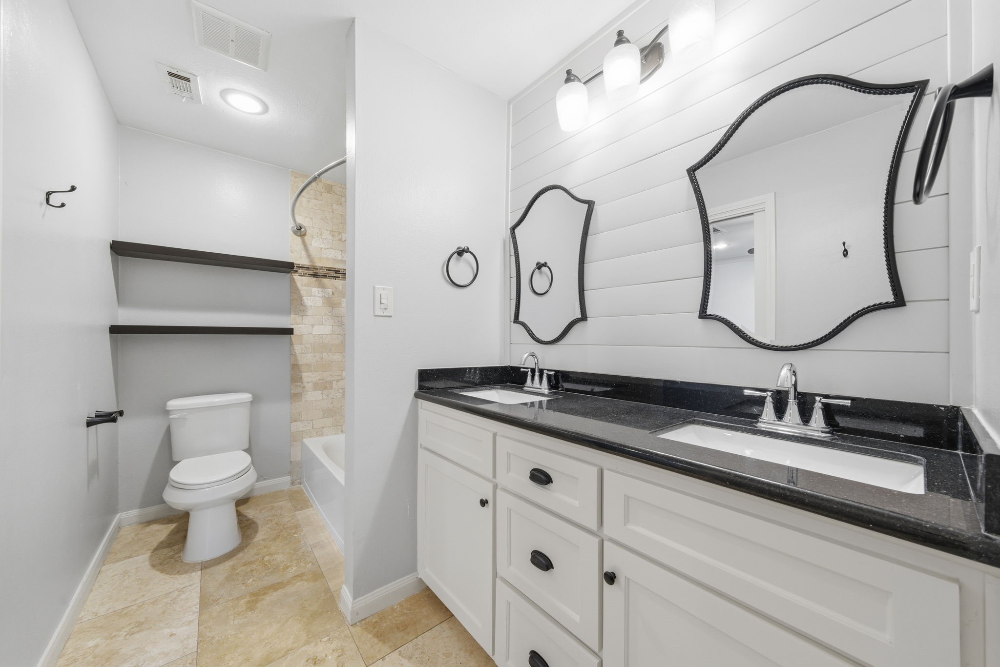 2502 Hollow Hook Road Houston, TX 77080 - Photo 30 of 35 a bathroom with a double vanity sink and a toilet